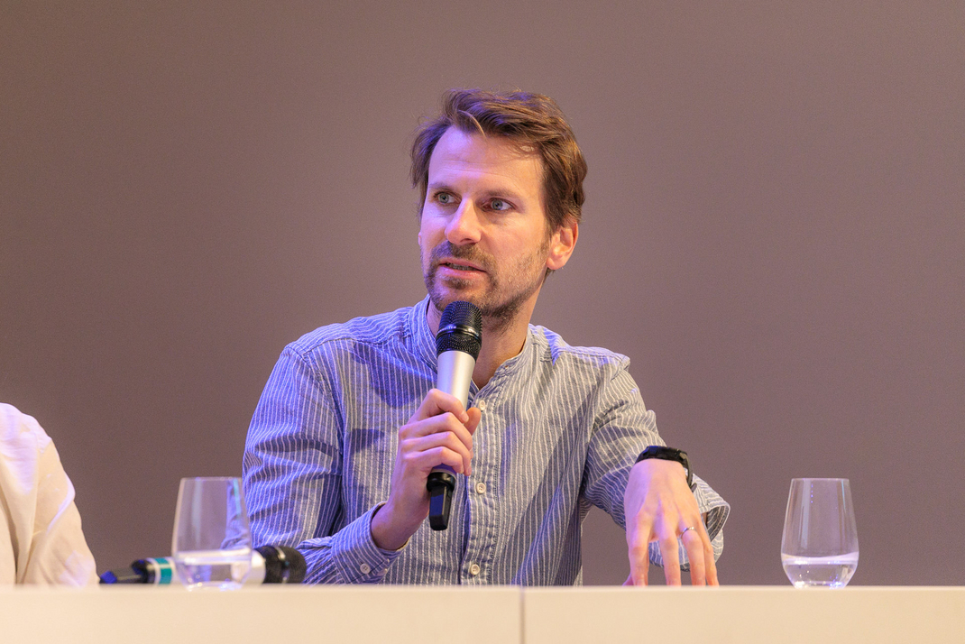 Experts discuss and debate together on the panel