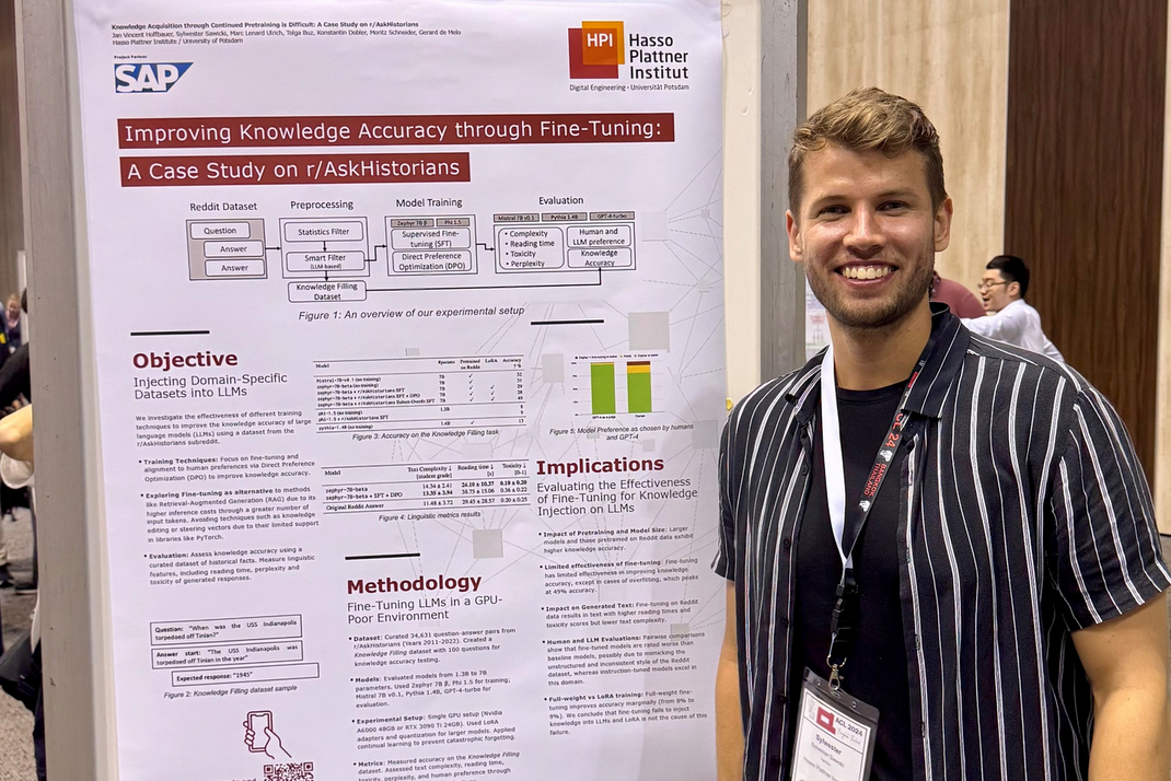 HPI master's student Sylwester Boldt stands in front of a scientific poster at the ACL Conference 2024.