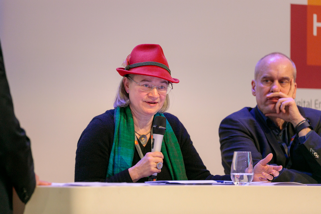 Experts discuss and debate together on the panel