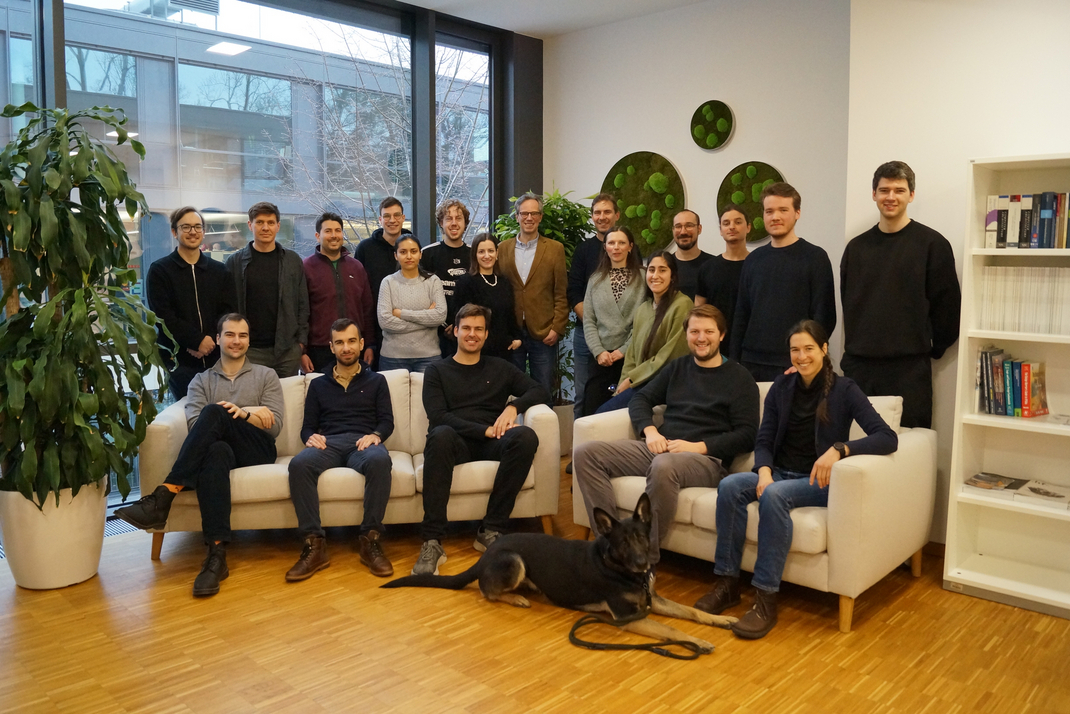 Photo of the members of the database group, and a dog.