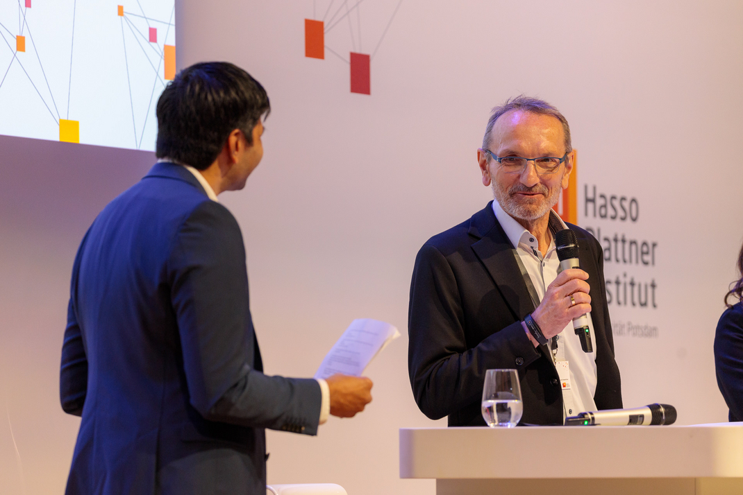 Experts discuss and debate together on the panel
