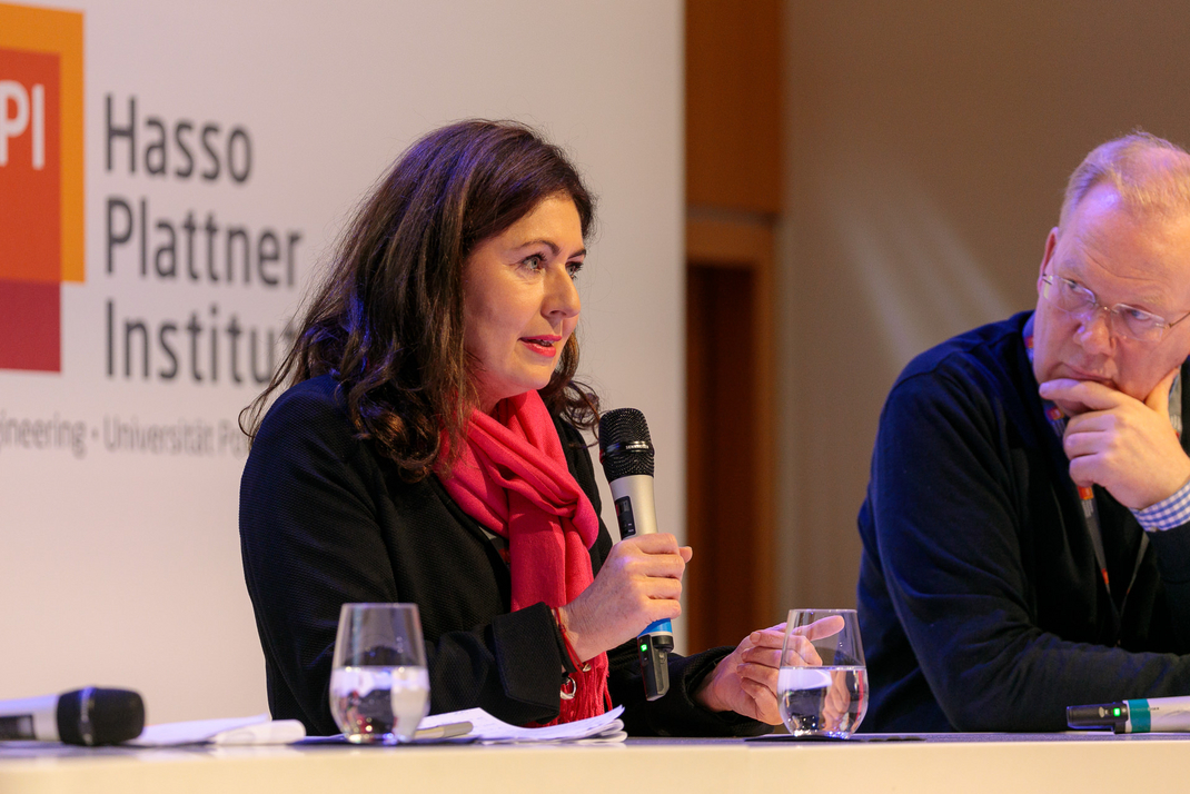 Experts discuss and debate together on the panel