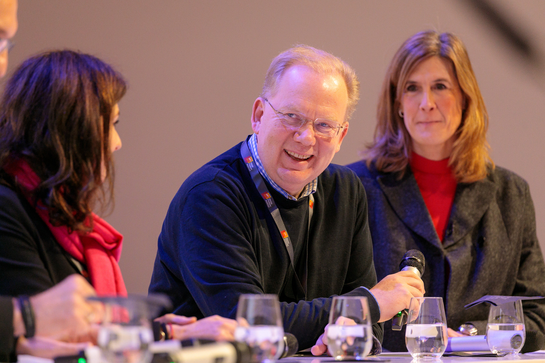 Experts discuss and debate together on the panel