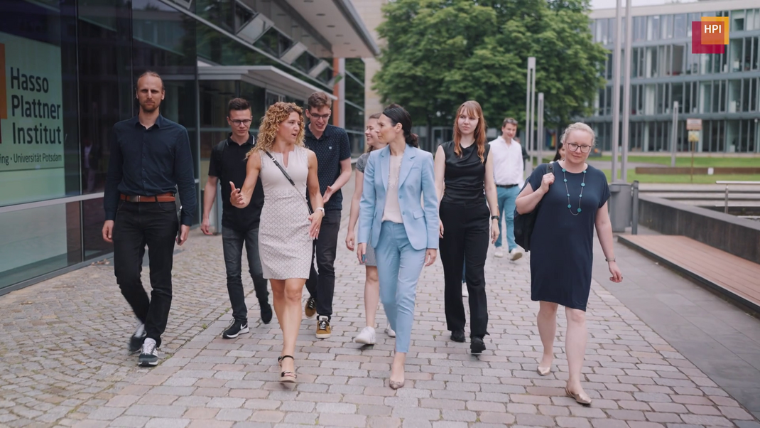 Group of People walking along on a campus tour