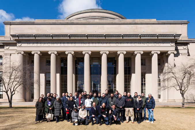 People in front of the Massachusetts Institute of Technology building