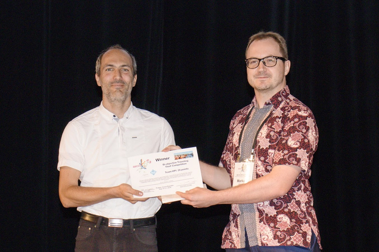 Prof. Friedrich accepting the 1st prize of the Bi-objective Traveling Thief Competition.